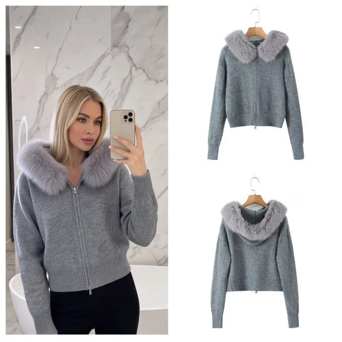A woman takes a mirror selfie wearing a light gray ribbed knit zip-up sweater with a large fluffy light gray faux-fur collar. The left side shows her in a bathroom setting, while the right side shows two clean product views of the sweater hanging on a wooden hanger against a white background.