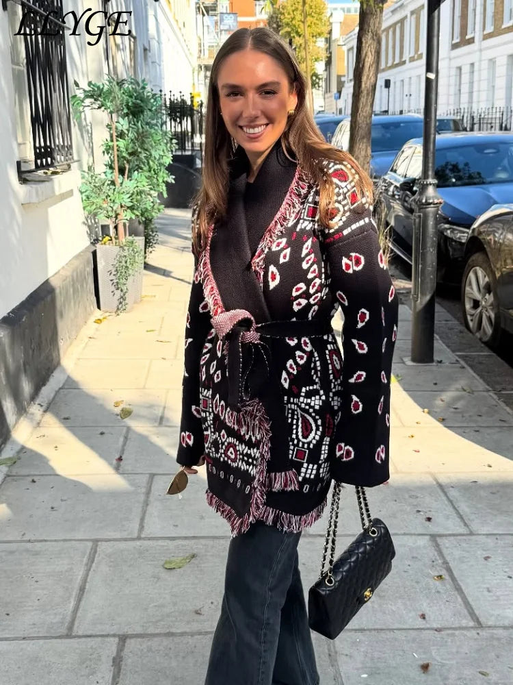 Woman wearing a patterned coat on a city street
